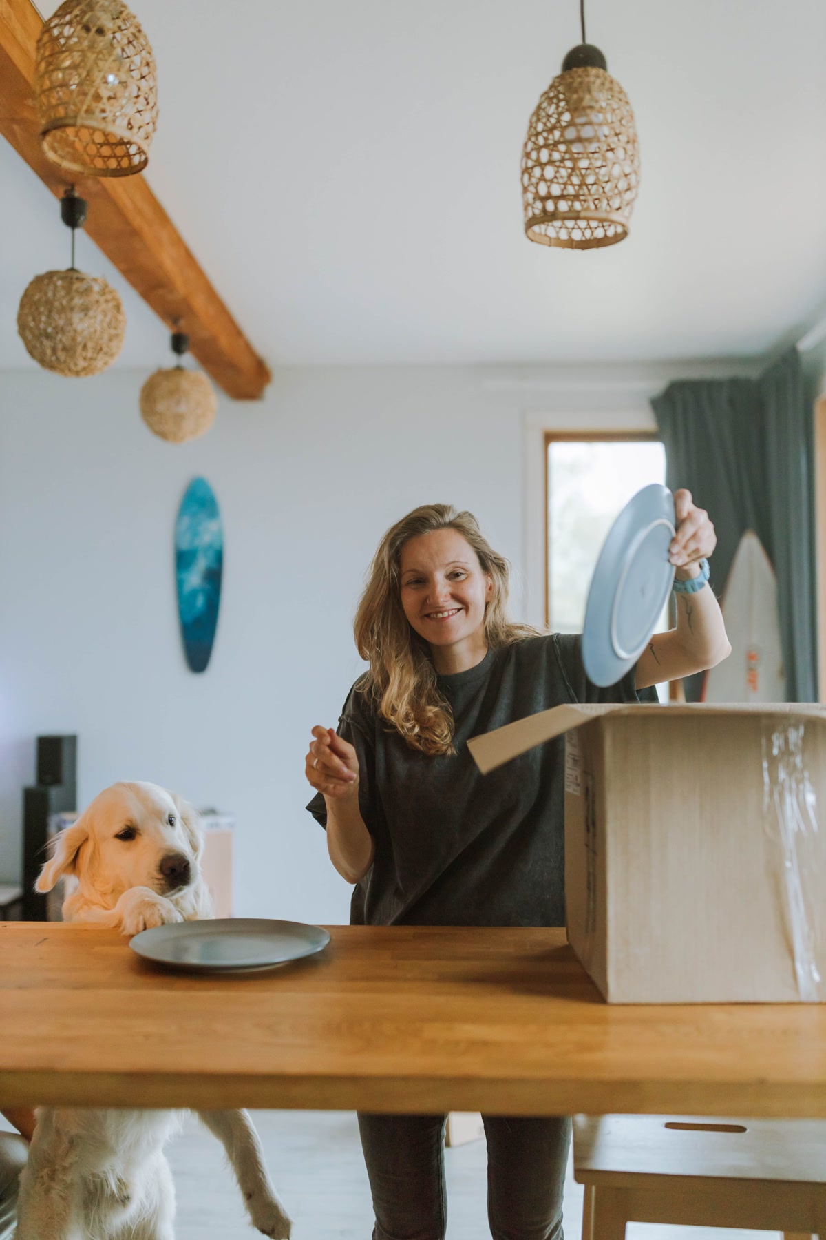 Golden retriever in a tidy dog-proofed kitchen with organized cords and secured cabinets