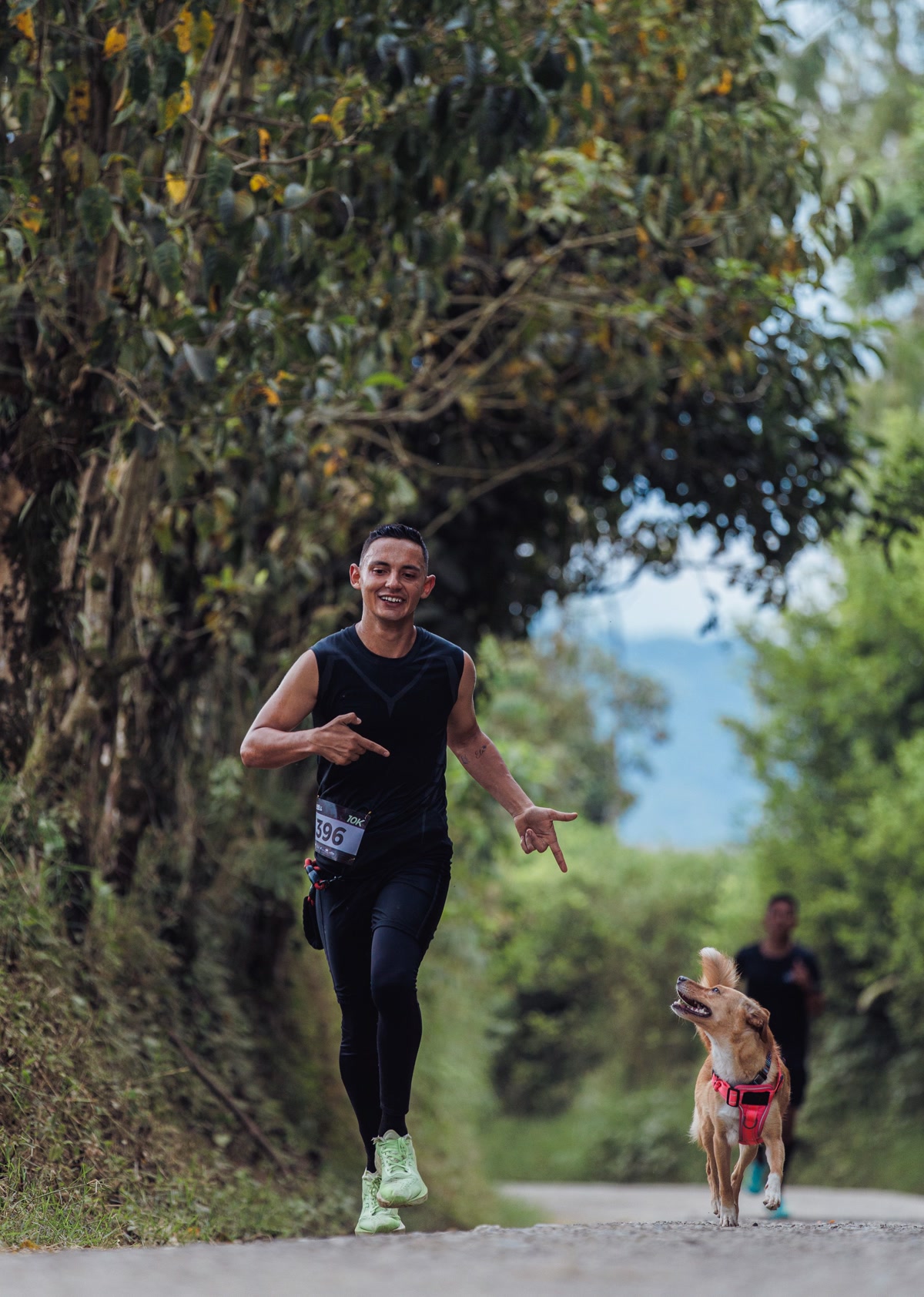 Pre-run stretching with dog on trail