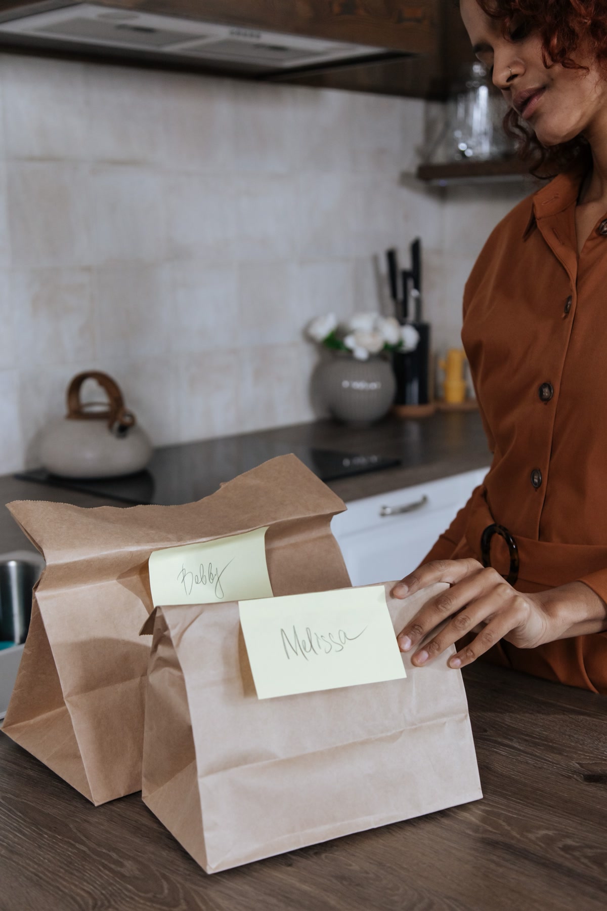 bags of quality mid-range dog food on kitchen counter with heartworm prevention medication