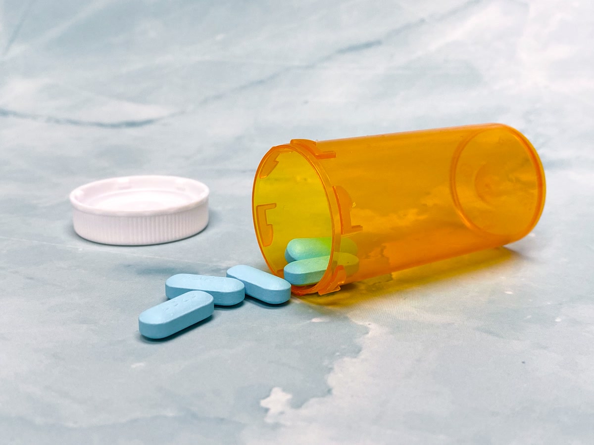 pet medication bottles with pills on table