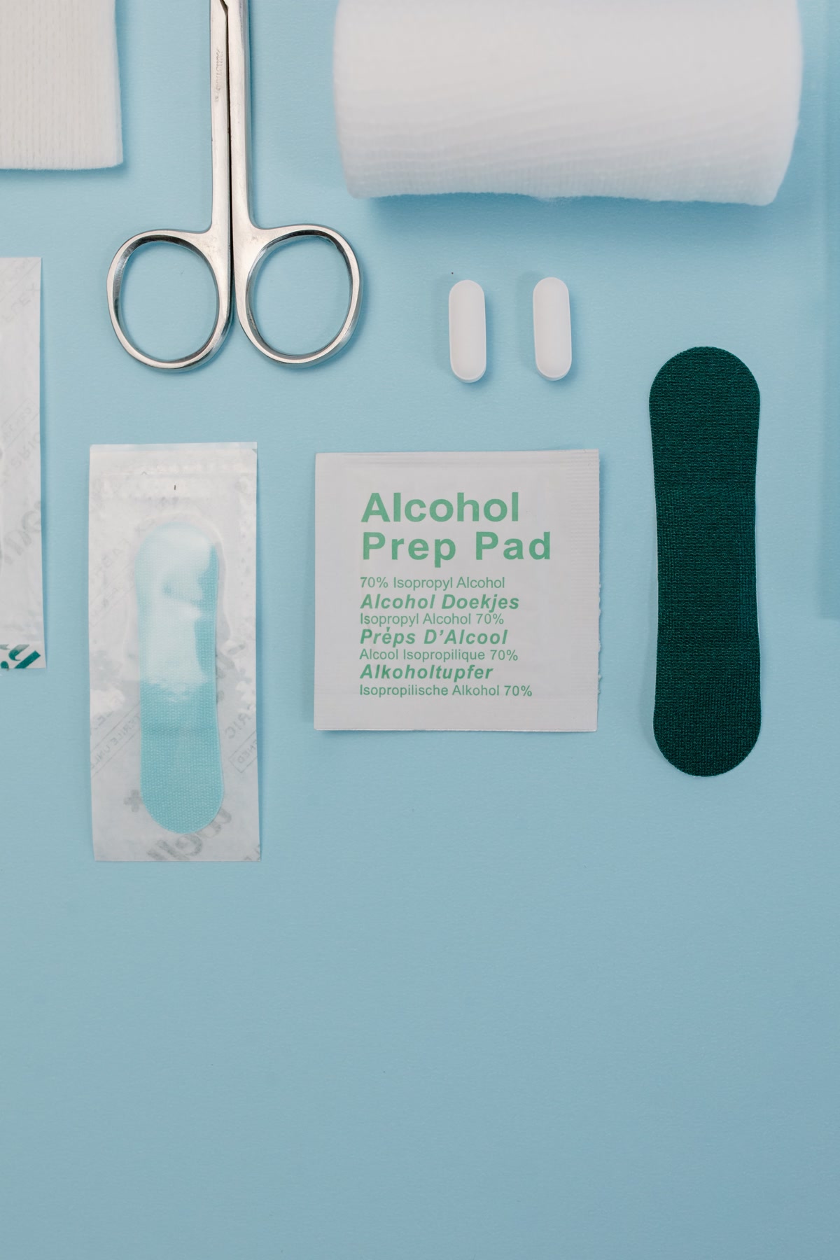 A Set of Cleaning Tools and Disinfectants on Blue Surface