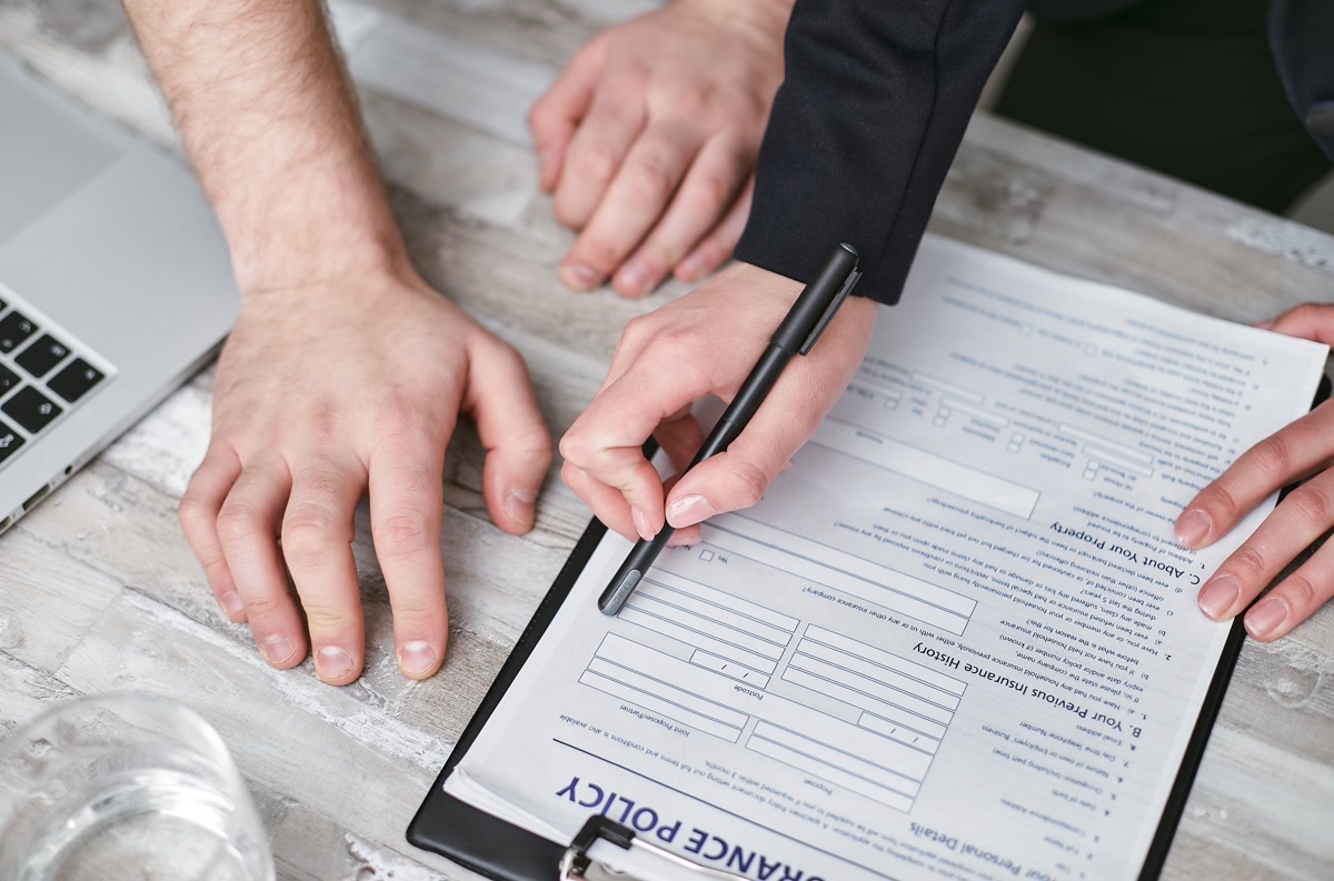 A Person Holding a Black Pen