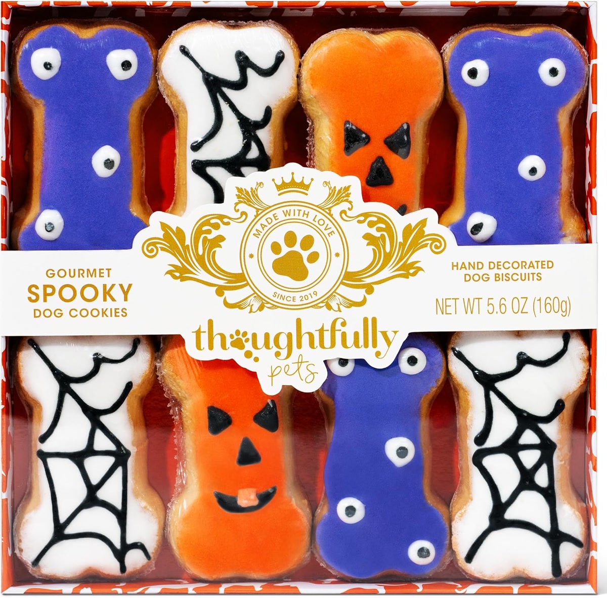 Halloween themed dog treats box with spooky bone shaped cookies