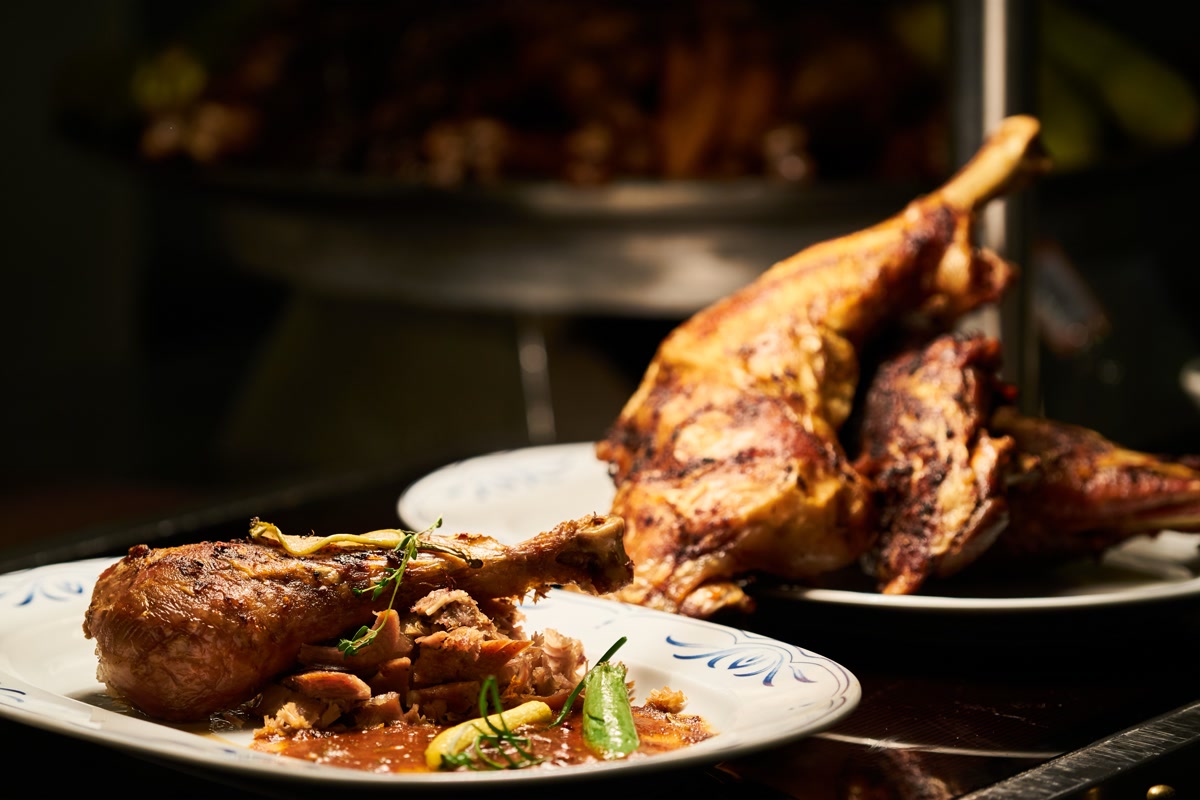 Roasted turkey legs on plate representing food to keep away from pets